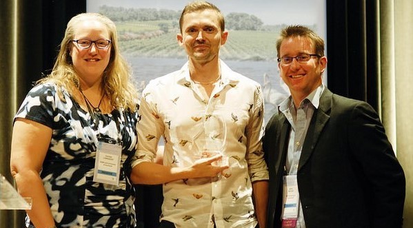 Photo Mike Hoffman accepted the DSA on behalf of IUCN Red List Committee at ICCB 2015.